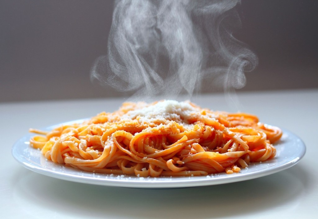 16647415 - italian spaghetti steaming with parmesan cheese.